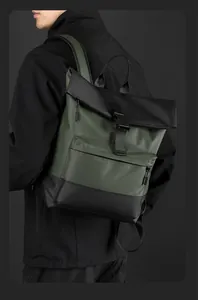 Detail of waterproof olive green and black backpack featuring a secure buckle closure