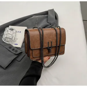 Detailed macro view of vintage brown leather bag with multi-layer accordion structure