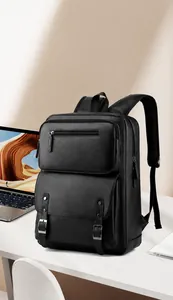 Detail of black PU leather business backpack with front zipper pocket and metal buckles