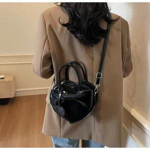 Bolso de mano con forma de corazón, lazo y correa ajustable para mujer, estilo moderno