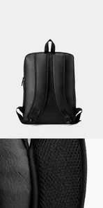 Detail of ergonomic breathable mesh back padding and padded straps on black backpack
