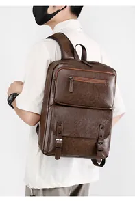Detail view of vintage dark brown faux leather backpack with metallic buckle closure