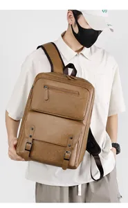 Brown vintage faux leather backpack featuring detailed grain texture and buckled flap