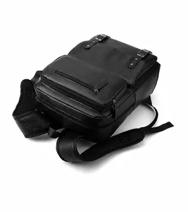 Detailed close-up of a black textured PU leather backpack with sturdy straps and metal buckles