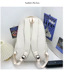 Rear view of cream-white backpack with padded shoulder straps and durable fabric texture