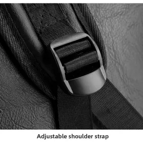 Detail of adjustable shoulder strap with plastic buckle on black lychee grain backpack