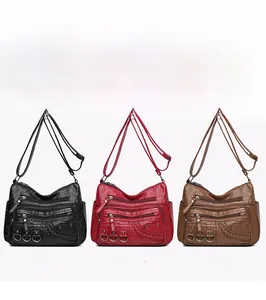 Tre borse a tracolla multi-tasche in pelle lavata nei colori nero, rosso e marrone scuro