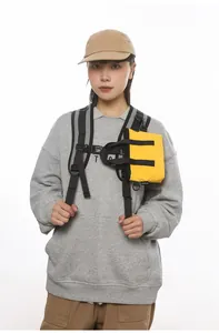 Detailed view of the bright yellow lightweight crossbody bag with adjustable black strap