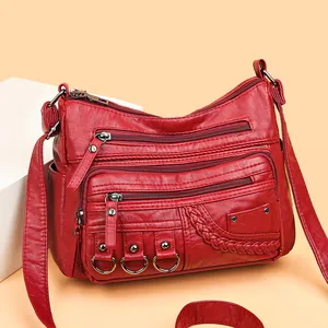 Borsa a tracolla rossa in ecopelle lavata da donna con tasche multiple e zip e intrecci