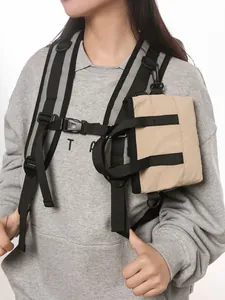 Modular khaki accessory pouch on black shoulder strap with reflective safety strips
