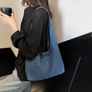 Minimalist blue denim hobo shoulder bag with spacious design for casual fashion style