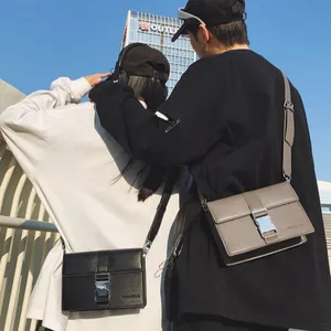 Minimalist leather crossbody bags with silver buckles in black and taupe for urban fashion
