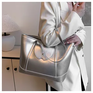 Detailed view of silver metallic tote bag showing premium synthetic leather texture