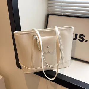 Minimalist cream white faux leather tote bag with front pocket and double shoulder straps