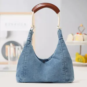 Blue denim hobo shoulder bag with stylish thick rope and brown leather handle