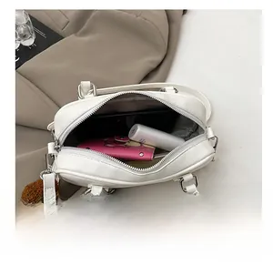 Internal view of the white Boston bag showing spacious capacity for daily essentials