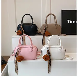 Litchi pattern Boston bags in four colors with bear charm and scarf details