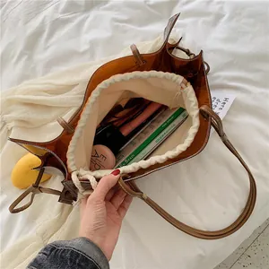 Brown transparent PVC tote bag with canvas inner pouch and large capacity for storage