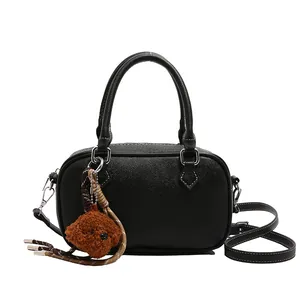 Litchi texture black Boston handbag for women with a cute brown plush bear charm
