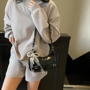 Fashionable black crescent shoulder bag with lace bow and pearl charm for women