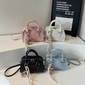 Boston style square handbags in pink white black and blue with embossed lettering