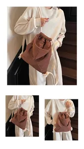 Detailed texture of brown waffle knit drawstring backpack with hoodie-style pocket design