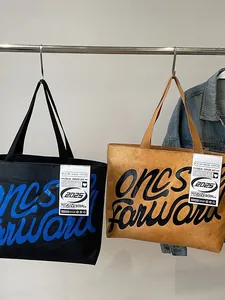 Waterproof DuPont tote bag in black and khaki with 'ones forward' artistic lettering print