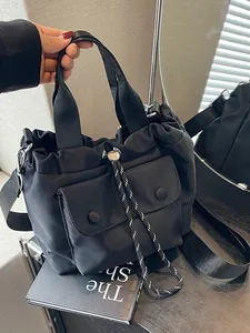 Lightweight black oxford drawstring bucket bag with dual handles and adjustable shoulder strap