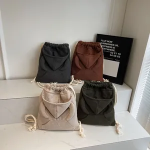 Fashionable waffle fabric drawstring backpacks with hoodie style pocket in four colors