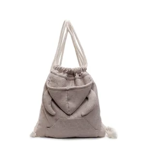 Fashionable waffle knit drawstring backpack with hoodie design for students and casual travel