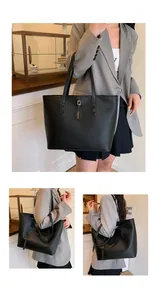 Close-up of black lychee grain texture and metal fashion tag on large tote bag