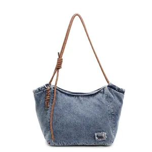 Large denim tote bag with chain strap and rope handle in vintage washed blue finish