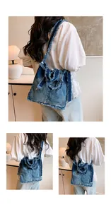 Detailed close-up of dark blue denim tote bag featuring a large knot and frayed edges