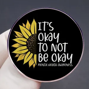 Spilla a girasole per la salute mentale con scritta It's Okay To Not Be Okay