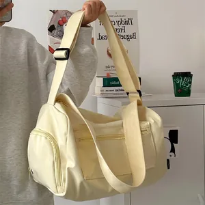 Large cream-white minimalist duffle bag with adjustable strap for yoga and travel