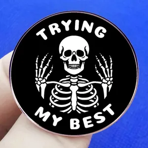 Round Trying My Best motivational skull pin badge with black and white metal finish