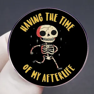 Round enamel pin featuring a cartoon running skeleton with humorous afterlife text