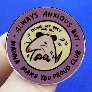 Round opossum enamel pin with Always Anxious but Doing My Best text on blue background
