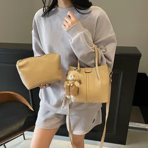 Beige lychee pattern shoulder bag set with a cute teddy bear charm for women