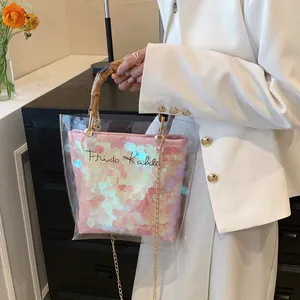 Transparent PVC tote bag with pink sequin inner pouch and bamboo handles for women