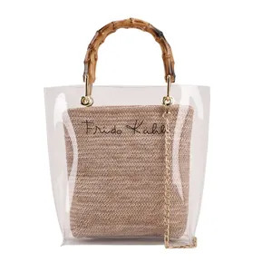 Transparent PVC tote with bamboo handles and straw interior bag featuring Frida Kahlo text