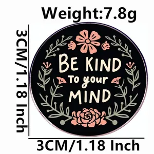 3cm Be Kind To Your Mind enamel pin with pink floral design on black metal background