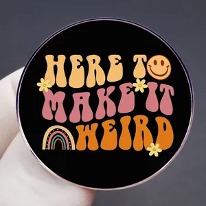 Retro Here To Make It Weird round badge with rainbow and smiley face on black