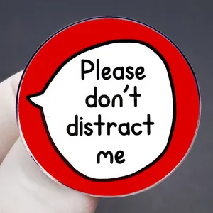 Funny red acrylic badge with 'Please don't distract me' text and white glove detail
