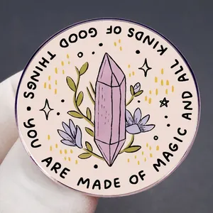Round brooch pin with crystal and flowers featuring You Are Made Of Magic text