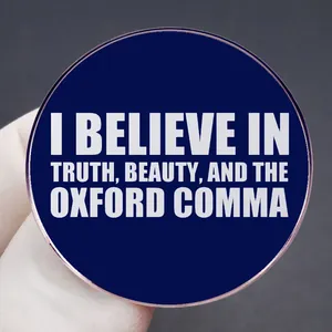 Round blue truth brooch with white English quote and metallic alloy edge detail