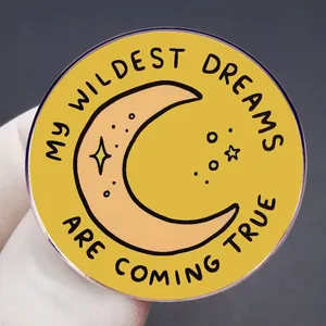 Round yellow enamel brooch with My Wildest Dreams Are Coming True quote and crescent moon