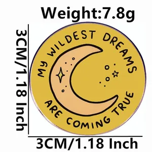 Inspirational round enamel brooch featuring My Wildest Dreams Are Coming True text
