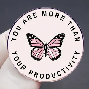 Pink butterfly enamel pin badge with 'YOU ARE MORE THAN YOUR PRODUCTIVITY' quote