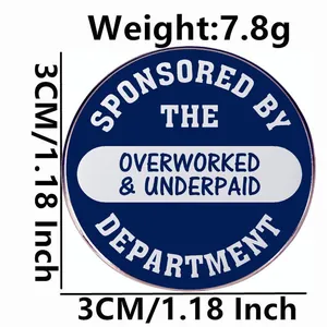 Round alloy brooch pin with Overworked and Underpaid text in blue, 3cm diameter